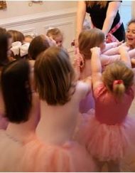ballerina party guests in pink tutus.